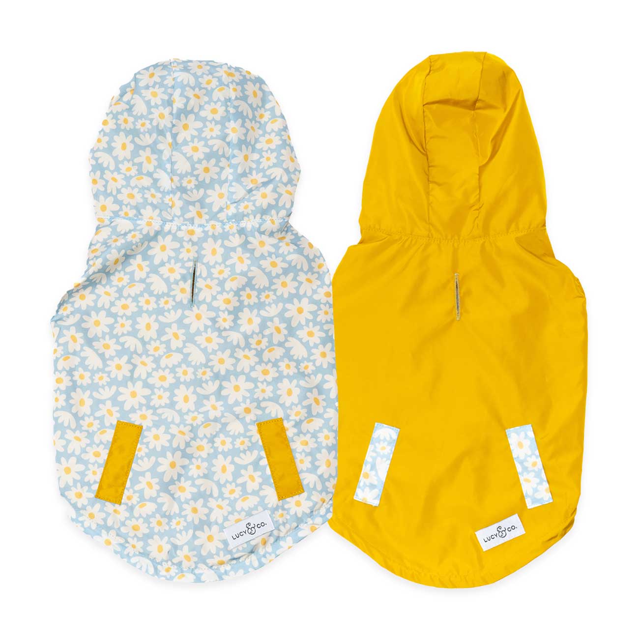 Two dog coats, one with a floral pattern and the other yellow showcasing reversible feature, on a white background.