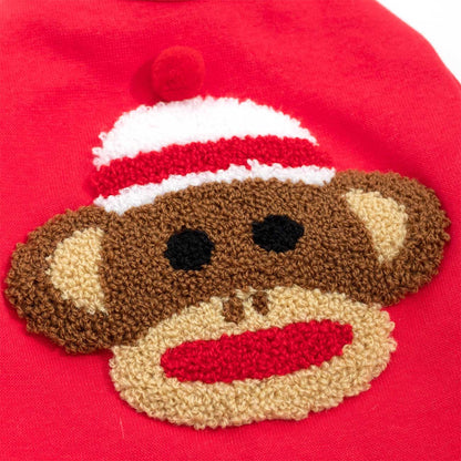 Sock monkey face patch on a red background