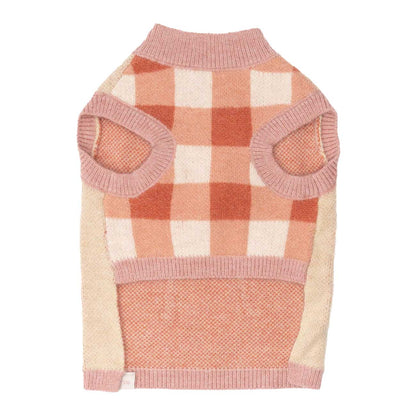Dog sweater with pink and beige checkered pattern on a white background