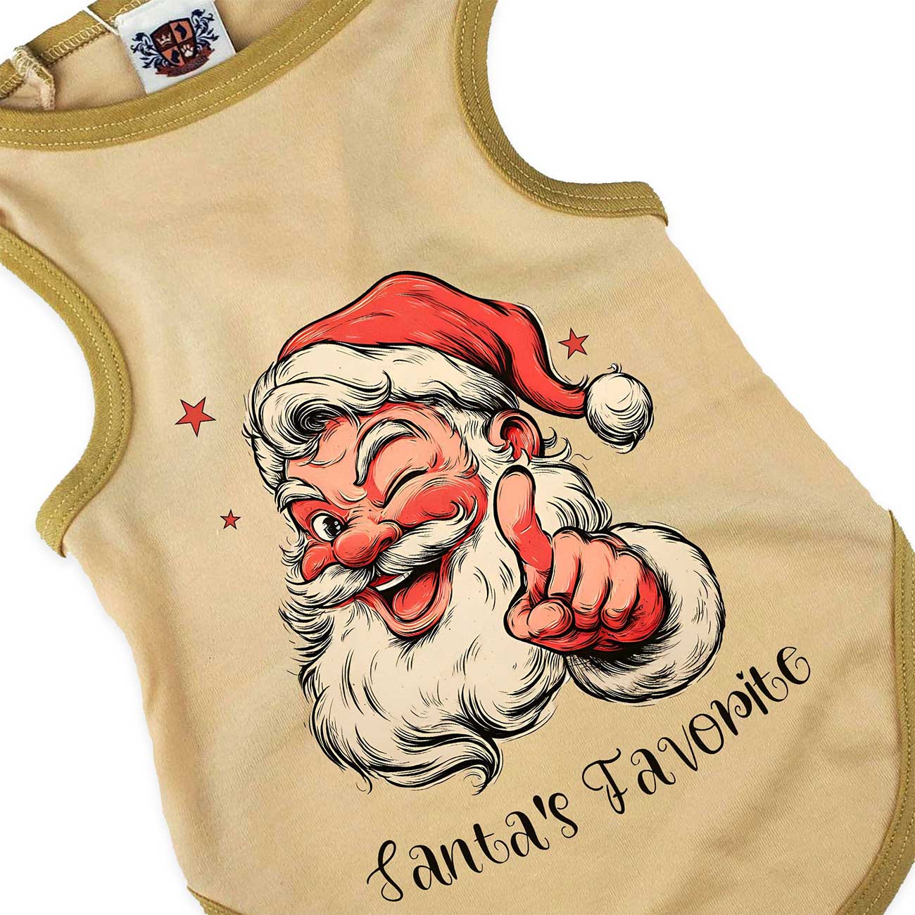 Beige dog top with Santa Claus graphic and 'Santa's Favorite' text on a white background