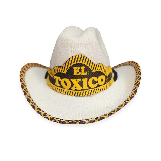 White cowboy dog hat with a yellow and black 'El Toxico' band on a white background