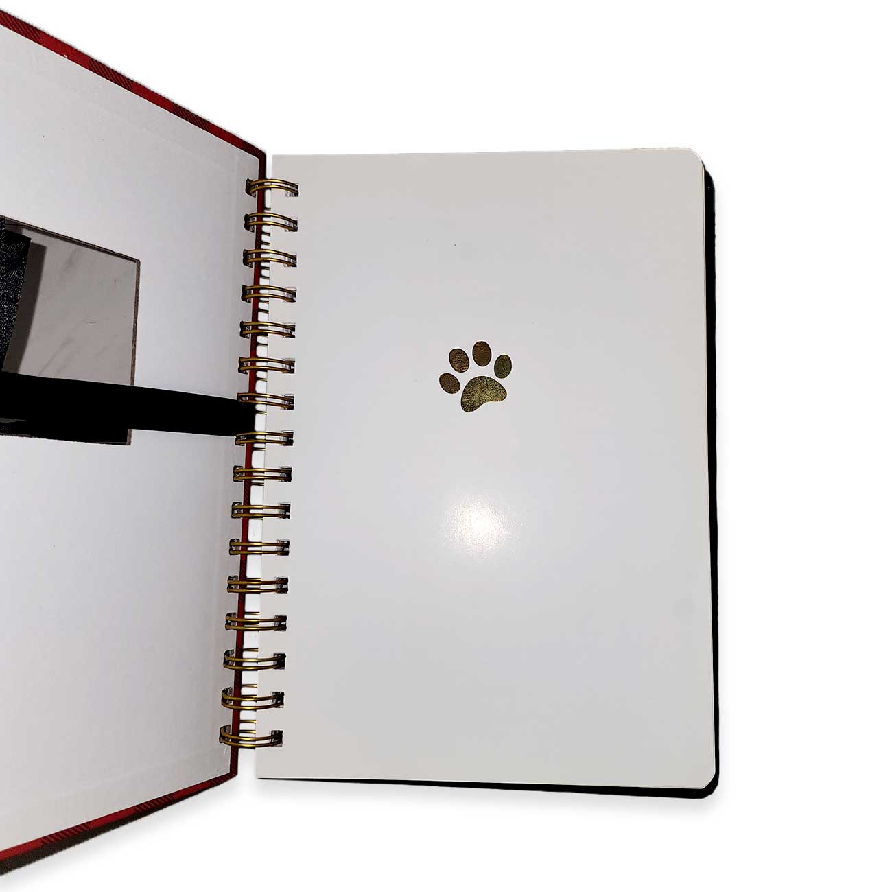 Open notebook with a paw print design on a white background