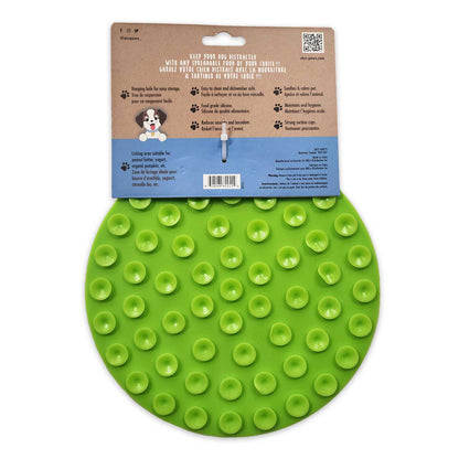 Green dog toy with packaging on a white background