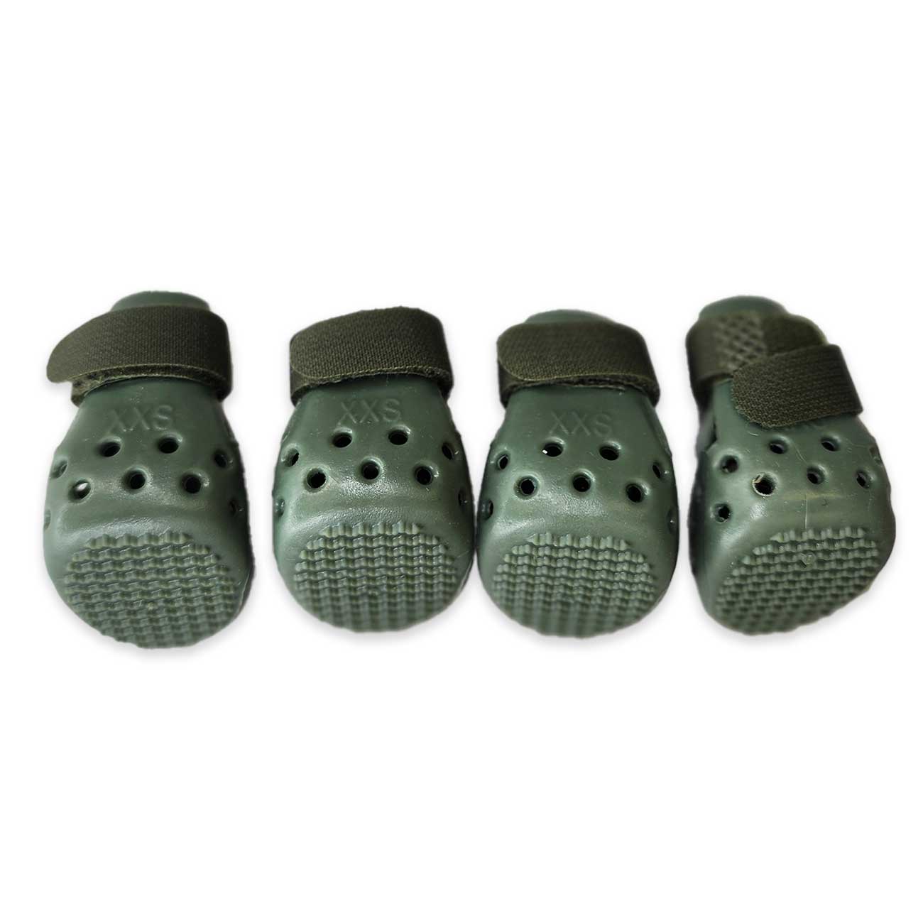 Four green dog booties with black straps on a white background
