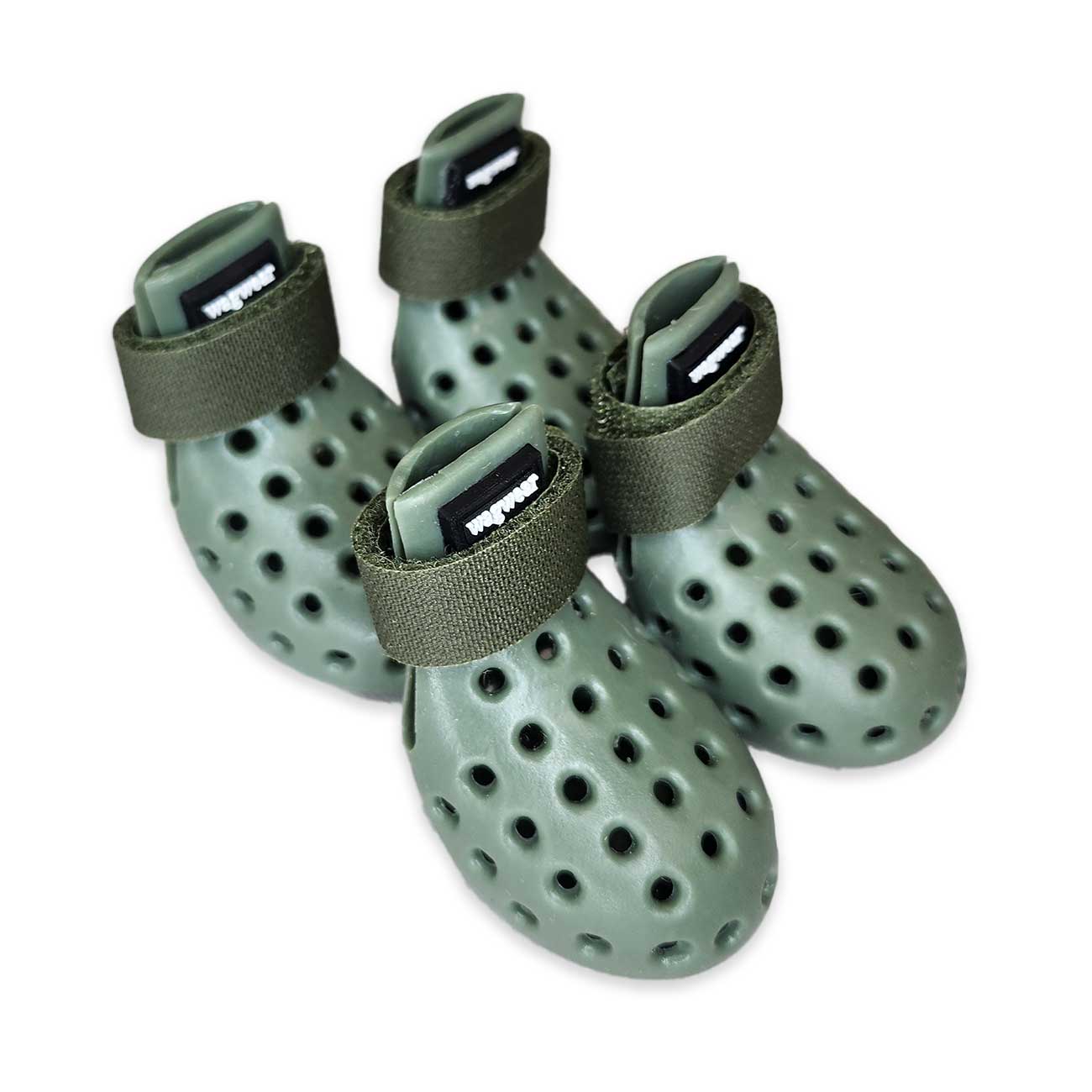 Four green dog boots with straps on a white background