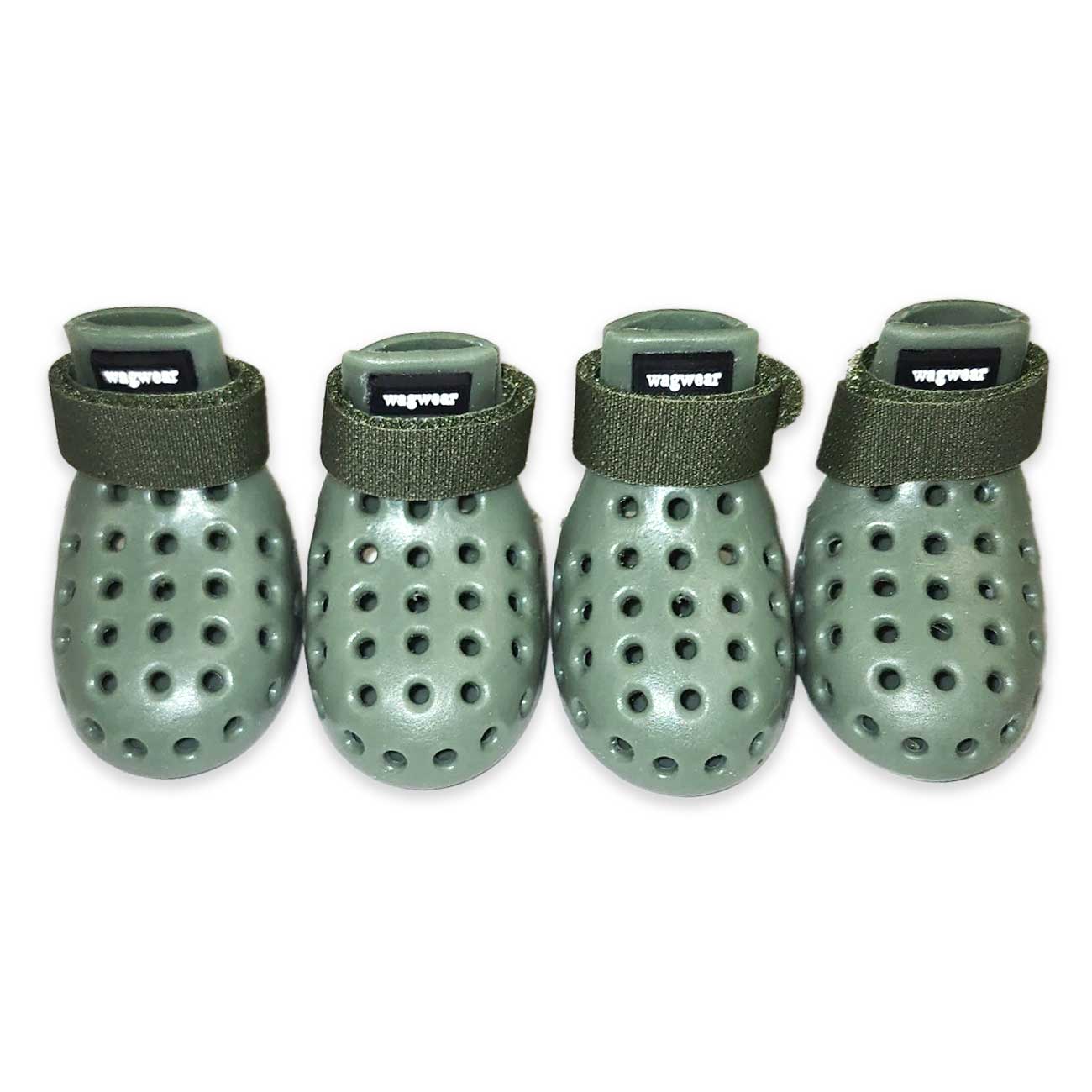 Four green dog booties with ventilation holes on a white background
